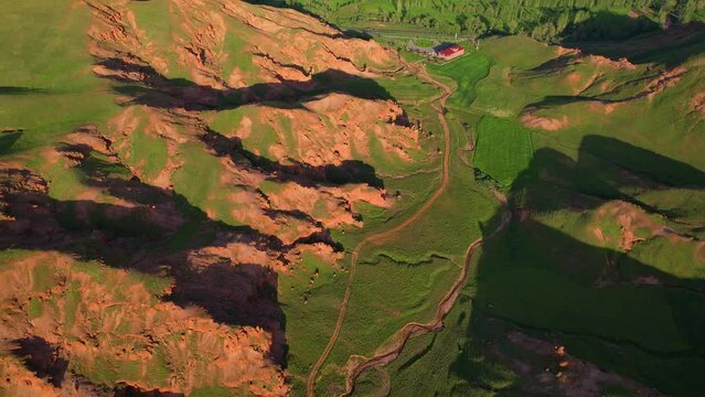 erzurum narman fairy chimneys green grass on red soil aerial view 4K