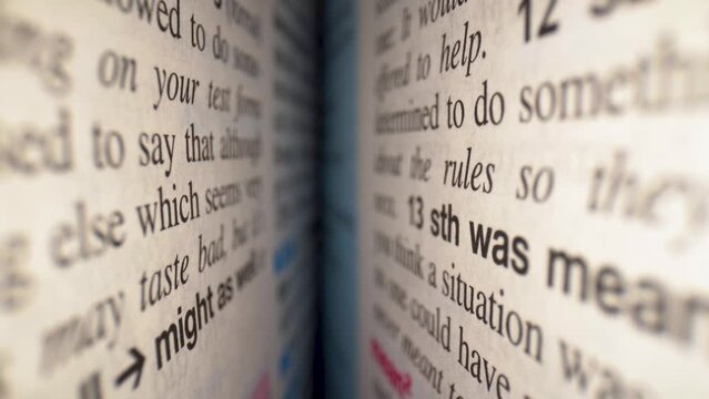Sentences in the dictionary close up 4K. Inside the book concept.