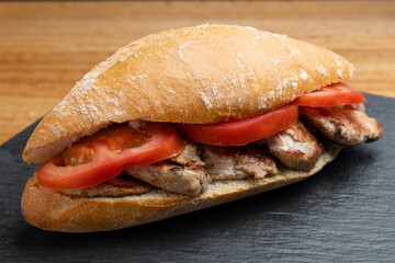 pork and tomato sandwich closeup