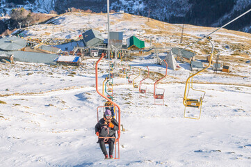 Chairlift at the ski resort. Ascent by cable car to the top of the mountain. Steel cable, blocks...