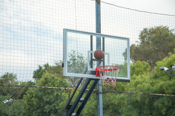 Ball in basketball hoop. Sport. Hobby. Lifestyle