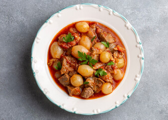 Traditional Greek dish of beef stifado in a sauce. Meat stew, onion stew. Turkish name; sogan yahni...