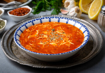 Chicken noodle soup with tomato. Turkish name; Domatesli tavuklu sehriye corbasi
