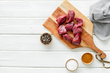 Raw beef meat with spices for cooking meal. Food background