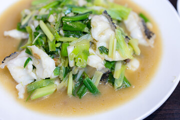 Slice of fish with vegetable soup