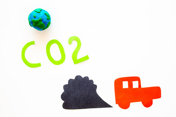 CO2 carbone dioxide control concept. Paper car and traffic fumes. Kids creativity