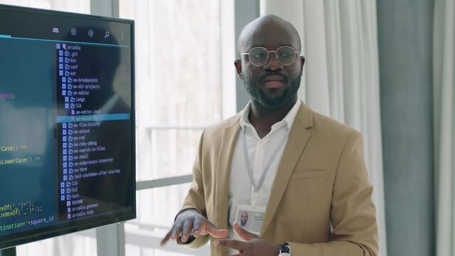 Specialist in development field conducting lectures on programming using visual representation for better understanding of material