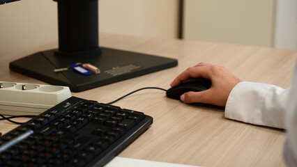 Close up of female hands typing on computer keyboard at the office. Clip. Young woman using computer.