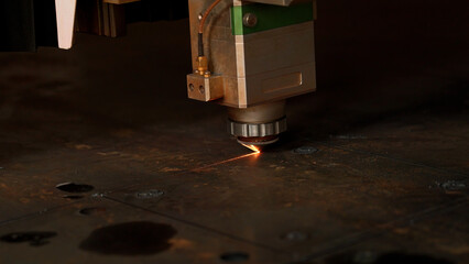 Industrial robotic laser cutter cuts metal parts with great precision. Creative. Close up of...