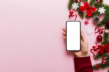 christmas mockup with space for text. christmas advertising, app template. hand holding phone with...