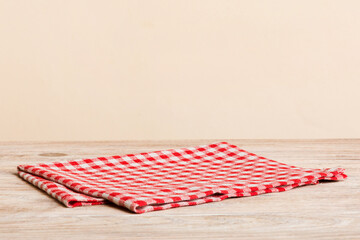 top view with red empty kitchen napkin isolated on table background. Folded cloth for mockup with...