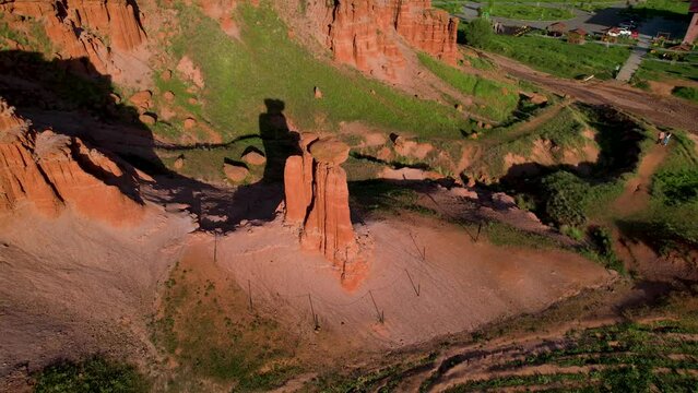erzurum narman fairy chimneys green grass on red soil aerial view 4K