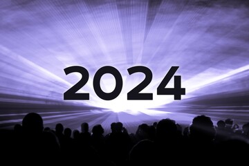 Happy new year 2024 purple laser show party people crowd. Luxury entertainment with audience silhouettes turn of the year celebration. Premium nightlife event at holidays season party time