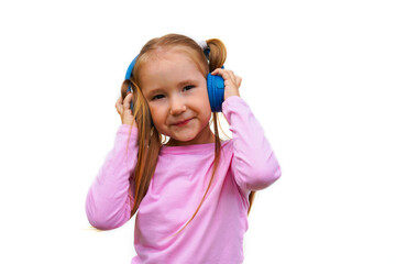 Carefree attractive girl with dark long hairstyle, listening music in headphones standing over white background