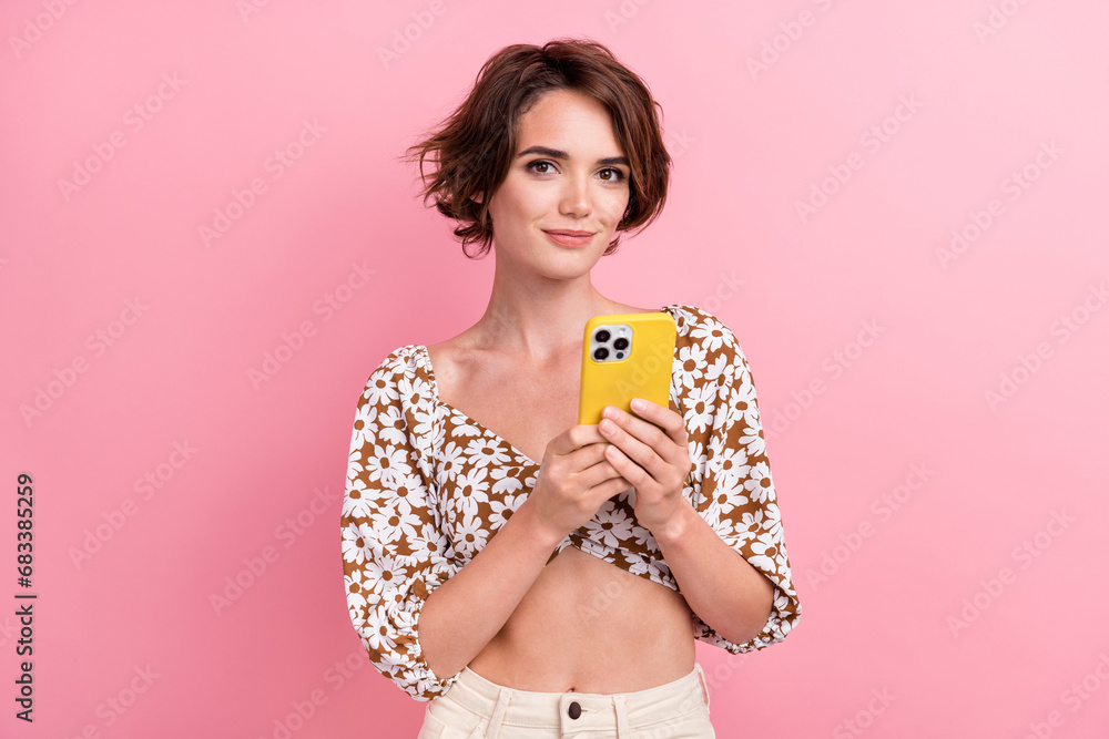 Sticker photo of confident young blogger lady hold yellow apple device apple phone 15 last model wear crop t