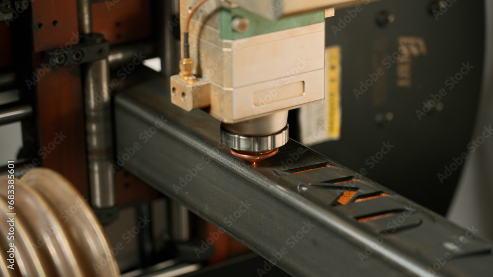 Aufkleber automatic cnc laser cutting machine working with metal bar with many sparks at factory. creative. me