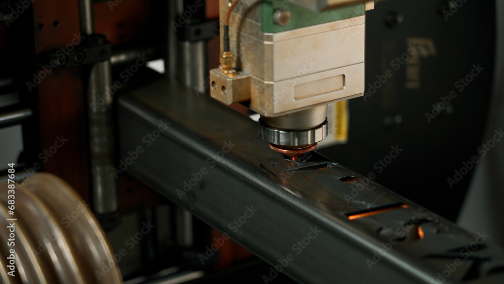 Poster automatic cnc laser cutting machine working with metal bar with many sparks at factory. creative. me