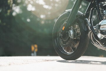 Motorcycle cruising on the road and resting on the ground, adding a touch of urban flair to the...