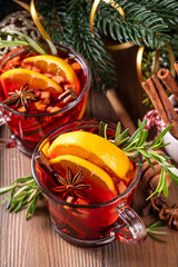 Traditional Christmas aromatic mulled wine cocktail, red wine grog tea drink with spices, cinnamon,...