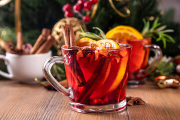 Traditional Christmas aromatic mulled wine cocktail, red wine grog tea drink with spices, cinnamon,...