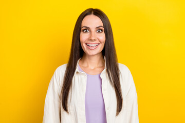 Fototapeta premium Photo portrait of pretty young girl excited toothy smile shocked dressed stylish white clothes isolated on yellow color background