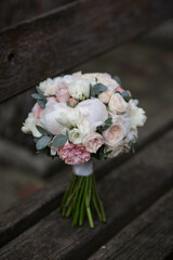 wedding bouquet, white peony and david austin roses. Fresh flowers. Wedding floristic.