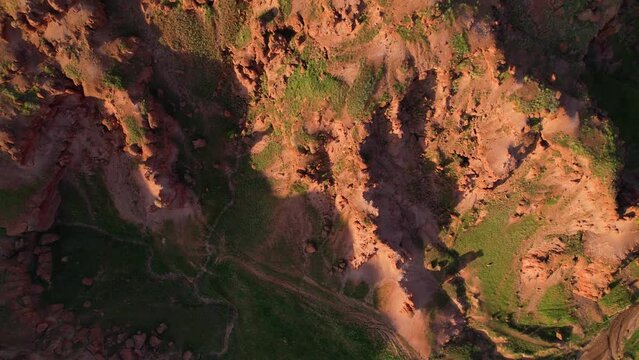 erzurum narman fairy chimneys green grass on red soil aerial view 4K