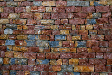 Colorful wall made of unusual bricks in bright, rich colors