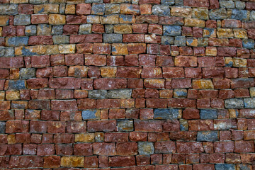 Colorful wall made of unusual bricks in bright, rich colors