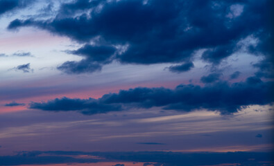 Dramatic dark moody blue and pink sunset sky. Natural background