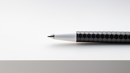A close-up shot of a ballpoint pen's textured grip, paired with a hexagonal pencil, highlighting...