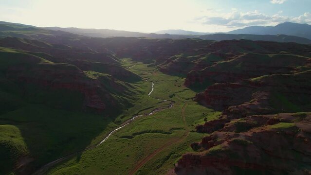 erzurum narman fairy chimneys green grass on red soil aerial view 4K