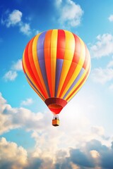 Obraz premium Colorful hot air balloon and aerostat floating in the blue sky. A delightful depiction of airborne adventure and the joyous spirit of celebration.