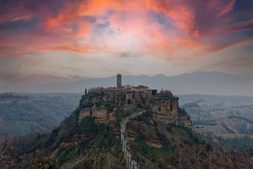 Foto auf Acrylglas Altes Gebäude Civita di Bagnoreggio ancient medieval village in Italy. Tourists from all over the world come to see the dying city on the mountain. sunset and clouds. travel picturesque and powerful village concept