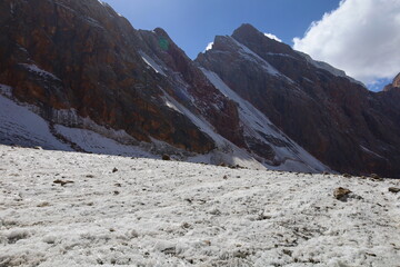 Rocky and glacial mountain landscape on a hiking trail from Iskandarkul to Chimtarga in Fann mountains, Tajikistan