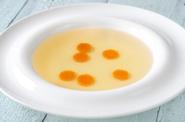 Chicken broth in plate