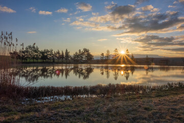 sunset over the river sun