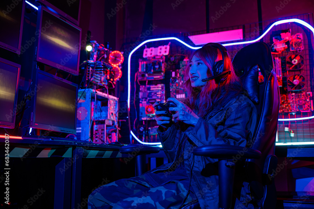 Poster gamer using joystick controller for virtual tournament plays online video game with computer neon li