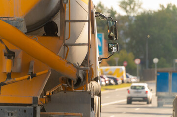 Concrete mixer truck on road. Selective focus