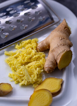 Grated ginger roots placed on a ceramic plate