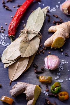 Bay leaves, garlic, ginger, chilies put on a wooden board