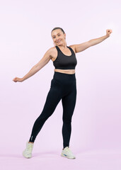Fototapeta na wymiar Active and fit physique senior woman portrait with happy smile on isolated background. Healthy lifelong senior people with fitness healthy and sporty body care lifestyle concept. Clout