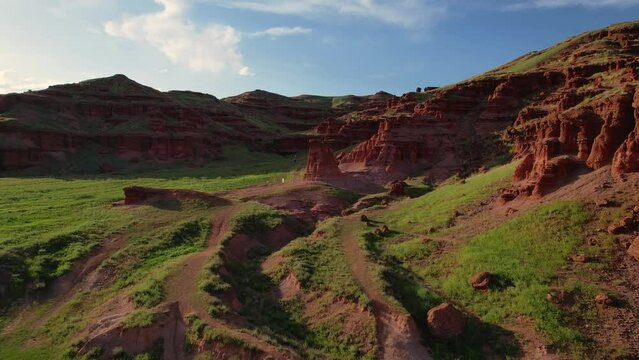 erzurum narman fairy chimneys green grass on red soil aerial view 4K