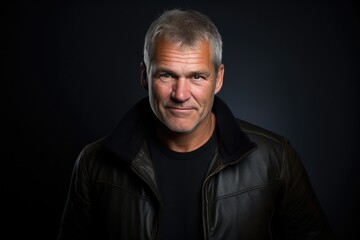 Obraz premium Smiling Man In Black Studio, Showcasing Sweater Artistic Portrait