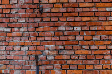 Old red brick wall damaged lightning rod collapsing brick wall