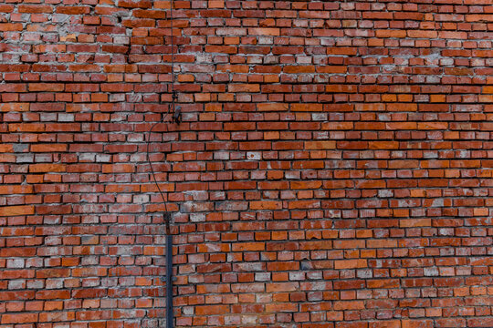 Old red brick wall damaged lightning rod collapsing brick wall