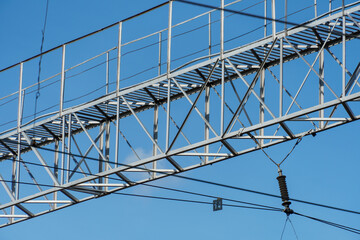 Power lines passing through huge distances to transmit electricity to the end user. Support of an overhead power line.