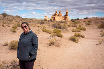 Happy overweight woman walking in the desert. Positive body image active lifestyle concept