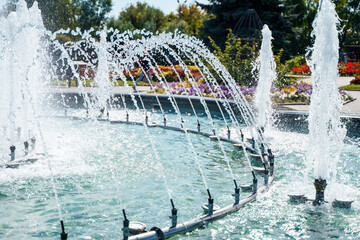 Beautiful fountain in the park on a summer day