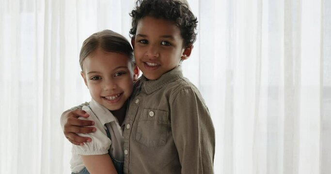 Children, face and siblings hug in a house with love, or and playing in their home together. Jewish family, portrait and kids embrace in living room with comfort, security or support, care or trust